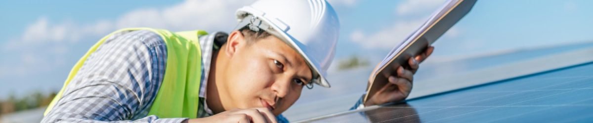 young-asian-inspector-engineer-man-working-solar-farm-technician-supervisor-male-white-helmet-checking-operation-sun-photovoltaic-solar-panel-station-copy-space